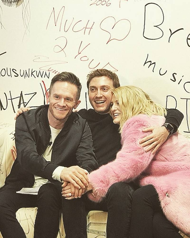 Meghan Trainor and Daryl Sabara embracing Syke.